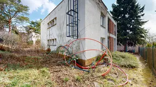 Objekt v obci Kníničky ev. č. 818 včetně parkovacích stání a garáží, ulice Rozdrojovická 